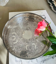 Load image into Gallery viewer, Small engraved circular silver plated tray 21cm across. Made in England
