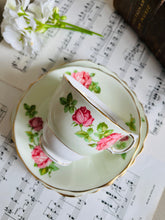 Load image into Gallery viewer, Colclough china 1940s pale green with pink cabbage roses teacup trio
