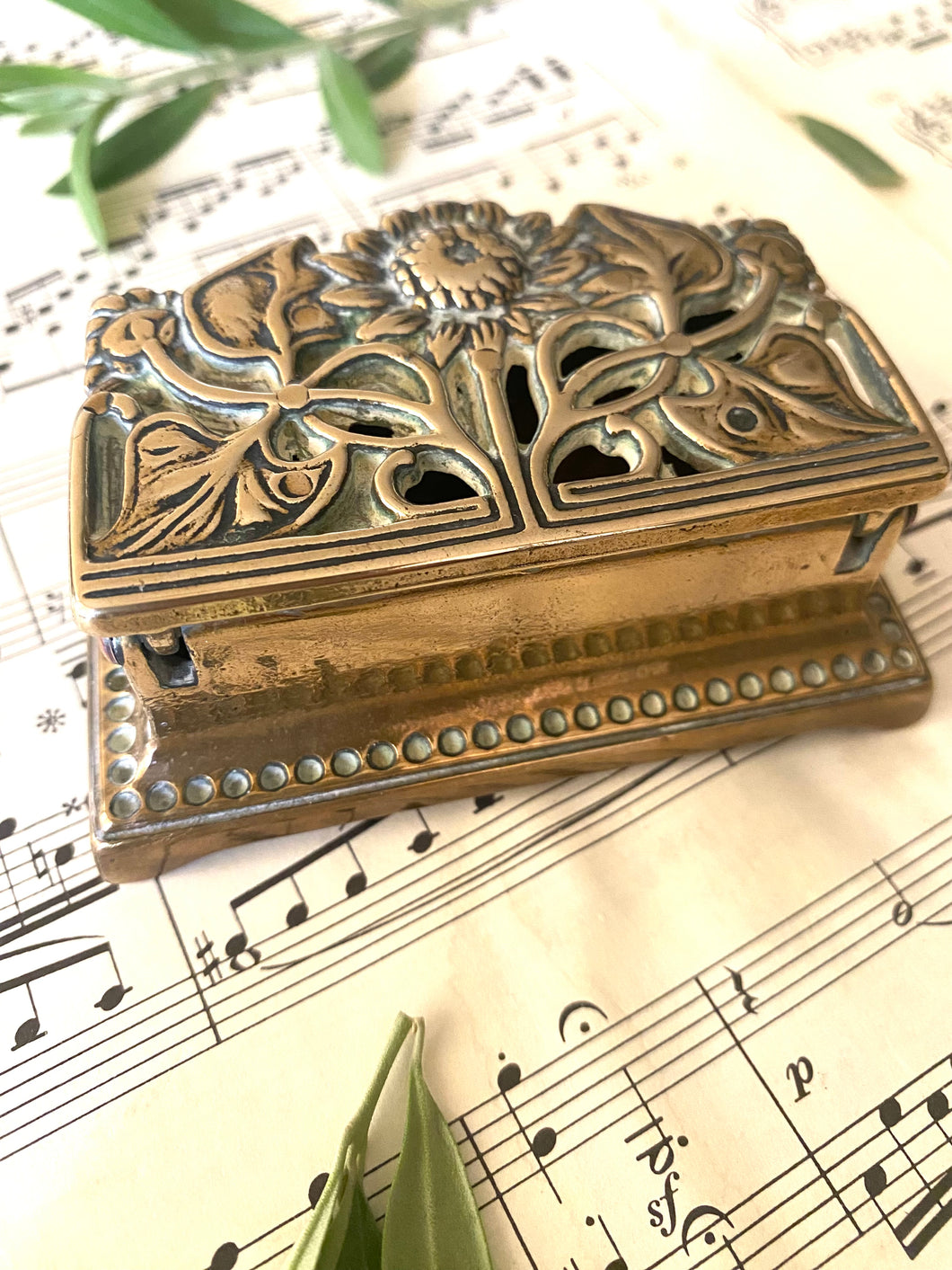 Original brass stamp holder with sunflower design circa 1910 9cm by 5cm