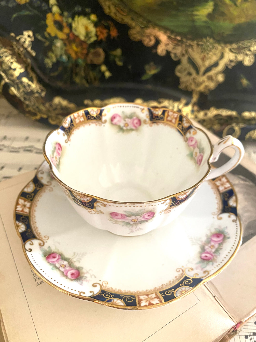 Antique handpainted teacup and saucer set