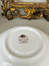 Load image into Gallery viewer, Royal Albert ‘flower of the month’ vintage teacup and saucer set for March
