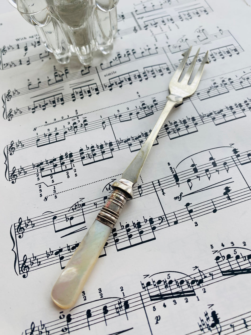 Antique silver plated pickle fork with mother of pearl handle