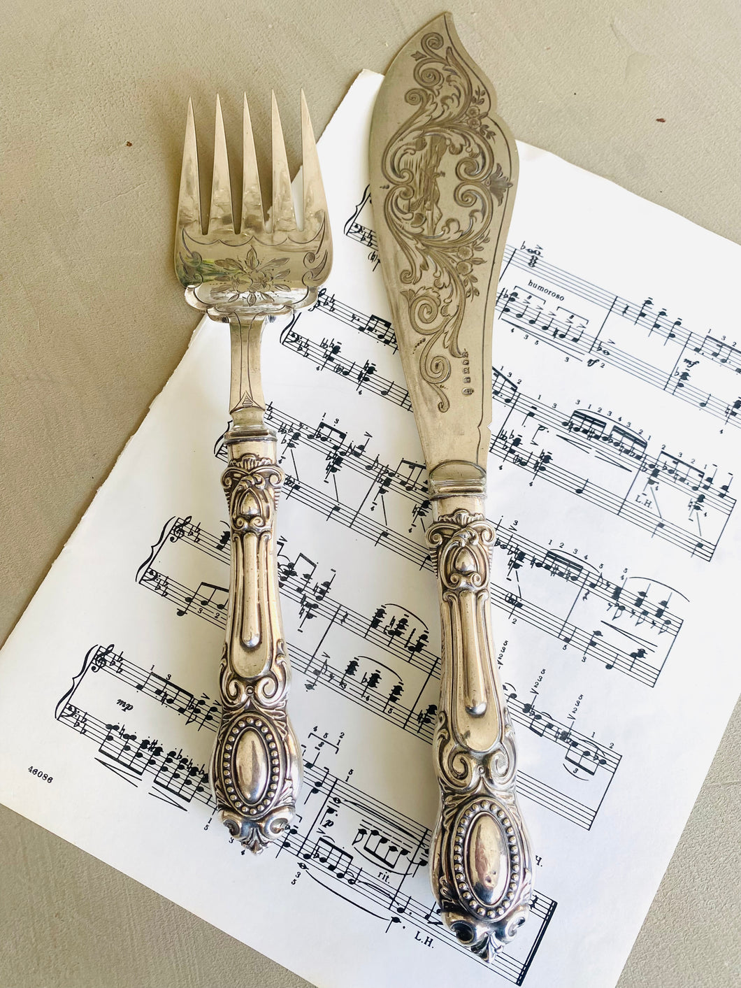 Set of ornate engraved fish servers