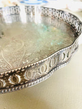 Load image into Gallery viewer, Large silver plate on copper engraved vintage tray with galleried sides and claw feet. Made in England
