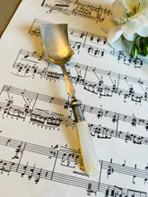 Load image into Gallery viewer, Antique cheese scoop with mother of pearl handle
