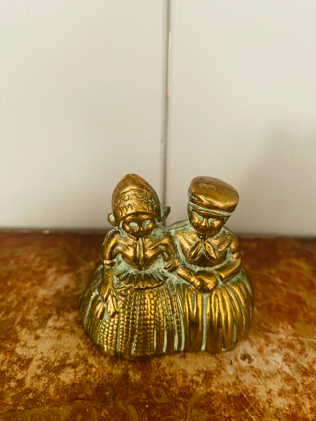 Small vintage boy and girl brass handbell